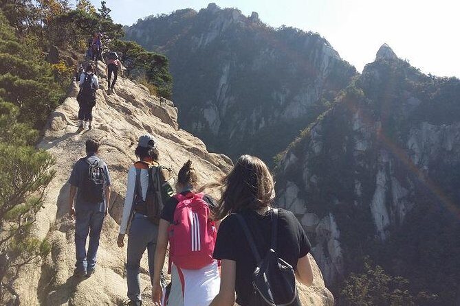 Hike at Mt. Bukhansan National Park with professional Guide(including Lunch) - The route: valley stream walking, a fortress wall gate, and a ridge temple