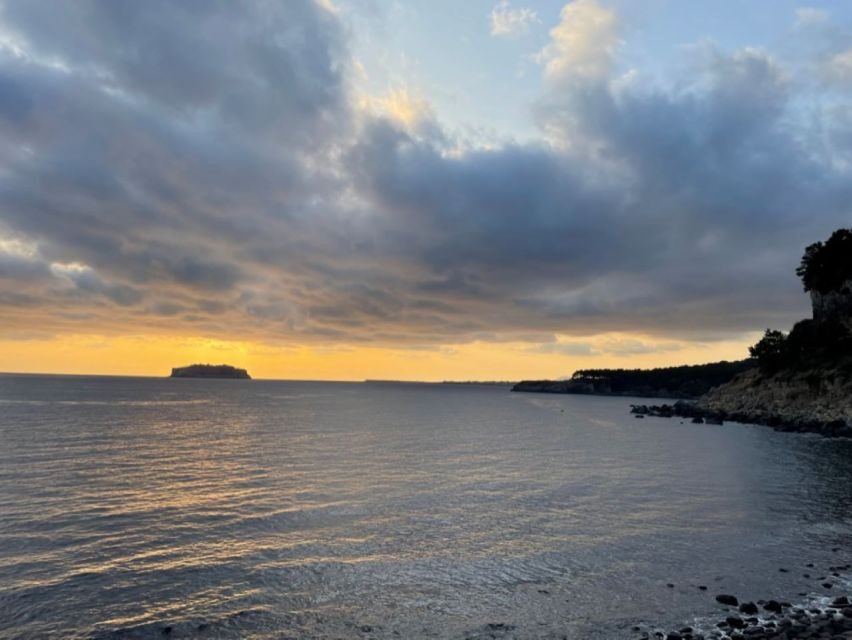 Jeju: Seogwipo City Walking Tours with Sunset - Stop 1: Cheonjiyeon Falls and the Earth-Sky Story